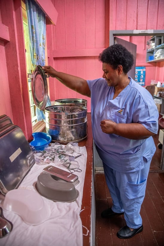 Veniana Rakaucoka, one of the nurses in the Wainobokasi Rural Hospital, prepares oxygen masks.
